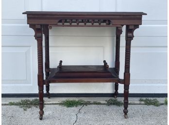 AN ANTIQUE MAHOGANY LAMP TABLE