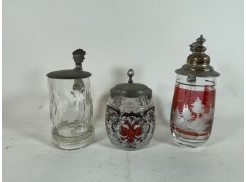 THREE GLASS GERMAN STEINS WITH PEWTER LIDS