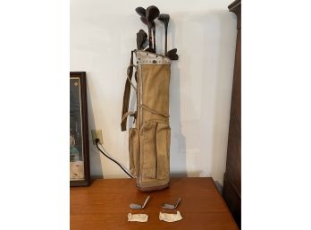 TWO MARILYN SMITH SPALDING GOLF IRON HEADS AND AN ANTIQUE GOLF BAG W/ 12 ANTIQUE WOOD SHAFT CLUBS