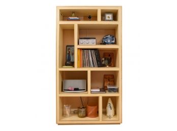 Shadow Box Bookshelf With Gilt Edge Trim And Various Geometrical Cubbies