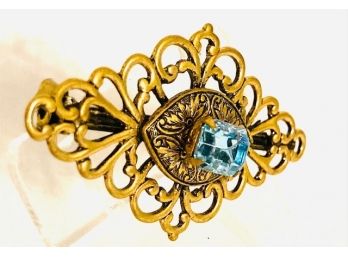 Sophisticated Diamond-shaped Filagree Scroll Brooch With Light Blue Colored Stone