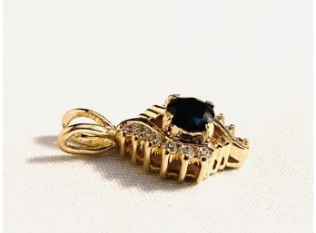 Gorgeous Gold Tone Pendant With Deep Blue Stone