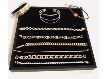 Collection Of Nine Gold And Silver Tone Bracelets