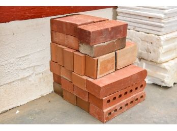 Seventeen Oval Bricks And Six Flat Bricks