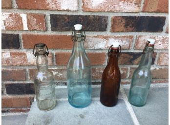 Four Vintage Flip Top Glass Brewery Bottles