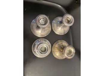 Four Weighted Sterling Silver Candlesticks