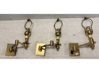 Three Swing Arm Brass Lights