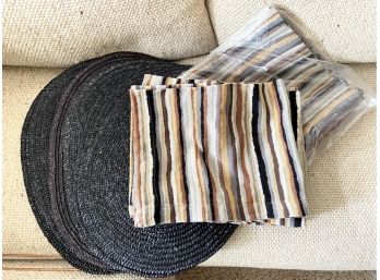 Black Raffia Placemats And Striped Napkins