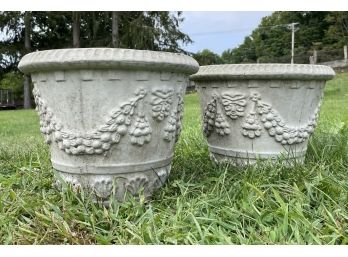 A Pair Of Cast Stone Planters