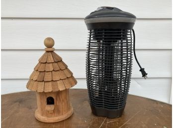 A Bug Zapper And Birdhouse