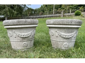 A Pair Of Cast Stone Planters