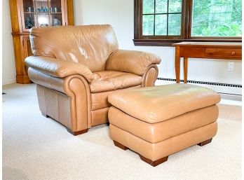 A Leather Arm Chair And Ottoman By Ethan Allen