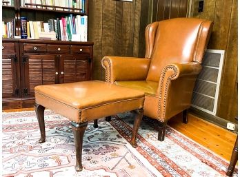 A Vintage Wood Framed Arm Chair And Ottoman With Nailhead Trim