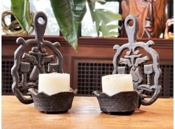 A Pair Of Cast Iron Trivet Candle Sconces