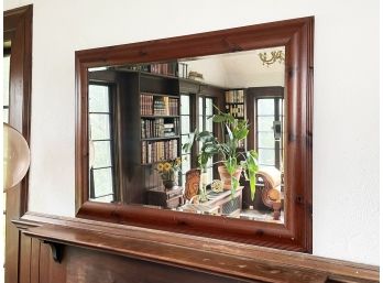 A Large Pine Framed Beveled Mirror