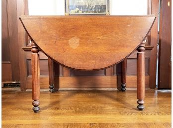 An Antique Turned Oak Drop Leaf Dining Table