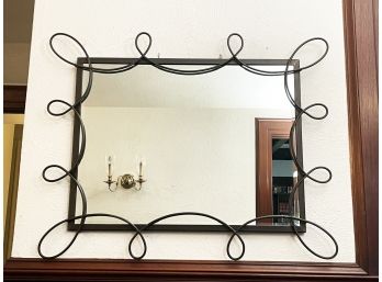 A Large Mirror In Whimsical Metal Frame