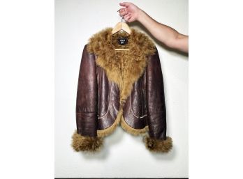 A Leather And Faux Fur Lined Jacket By DKNY