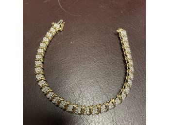 10k Gold  And Diamond Tennis Bracelet 7 Inches Long . 198 Small Diamonds