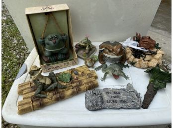 A Group Of Decorative Garden Frogs