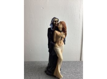 Grime Reaper Holding A Beautiful Woman Figurine