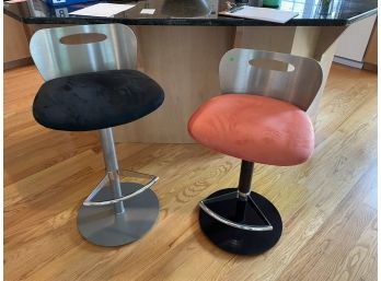 PAIR OF BRUSHED STEEL ADJUSTABLE STOOLS BY ELITE FURNITURE CO., ONE UPHOLSTERED BLACK AND ONE PINK