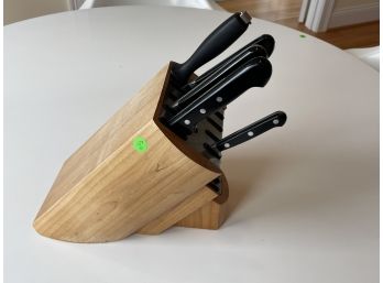 FIVE WUSTHOF KNIVES IN A CHICAGO CUTLERY KNIFE BLOCK