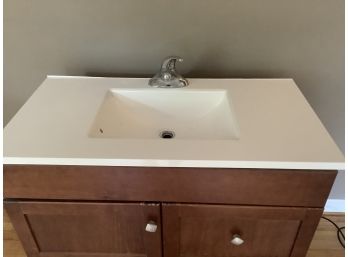 Bathroom Vanity Cabinet With White Countertop And Faucet Fixture