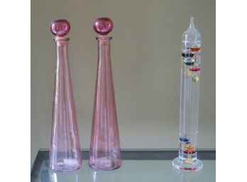 Grouping Of Lovely Pinkish Cranberry Decanters And Galileo Thermometer