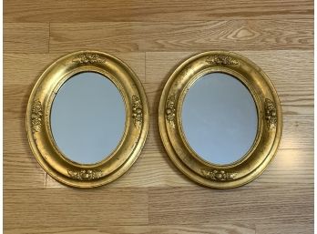 Two Gold Framed Oval Mirrors