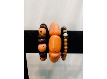 Trio Of Orange Tone Bracelets