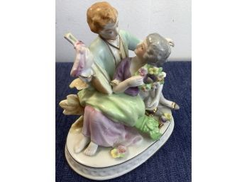 Man With Mandolin, Sitting With A Women Figurine