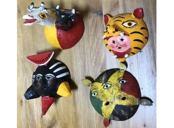 Four Small Decorative Masks