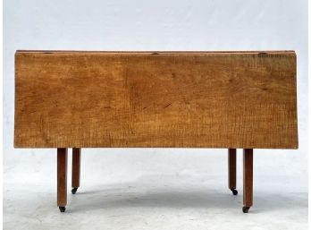 An Early 19th Century Maple Gate Leg Drop Leaf Dining Table