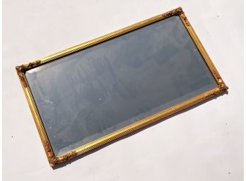 An Antique Mirror In Carved Gilt Wood Frame