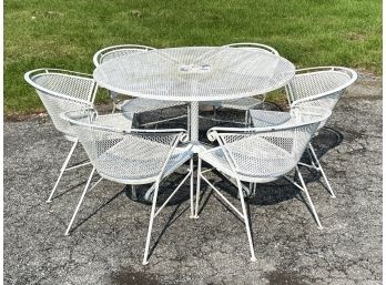 A Vintage 1960's Wrought Iron And Mesh Resort Style Table And Dining Chairs