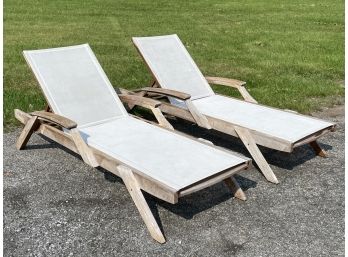 A Pair Of Modern Teak And Webbed Lounge Chairs By Pottery Barn
