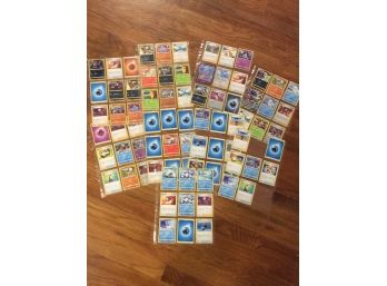 Lot Of Approximately 100 Pokemon Cards In Sheets