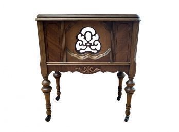 Nightstand With Pierced Medallion On Casters