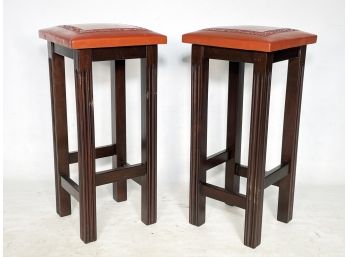 A Pair Of Vintage Leather Top Bar Stools