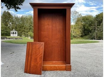 A Veneered Wood Bookcase With Adjustable Shelves