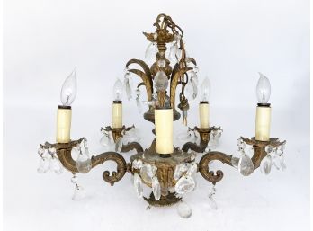 An Antique Bronze And Crystal Chandelier