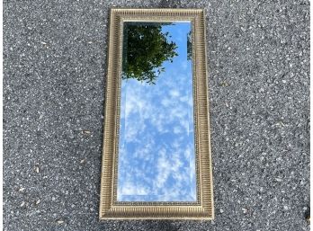 A Gilt Framed Beveled Mirror