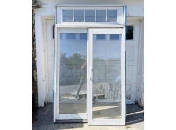 A Double Sliding Glass Door With Transom