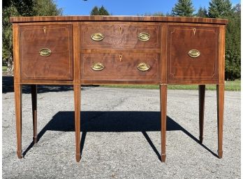 An Antique Veneered Marquetry Bow Front Sheraton Credenza, Marked E. Liberti