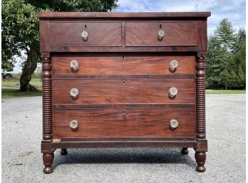 A Late 19th Century Carved Mahogany And Veneer Chest Of Drawers