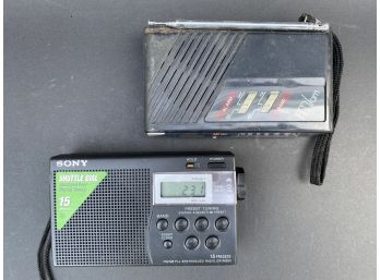 Two Vintage Hand-Held AM/FM Clock Radios