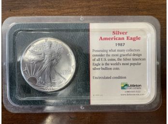 Silver American Eagle Philadelphia 1987 Uncirculated From Littleton Coin Company. Liberty Walking.