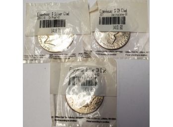 Three Eisenhower Uncirculated Dollar Coins- 1776 - 1976 S VI, 1977, 1978- D. Sealed Littleton Coin Packets