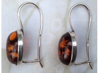 AMBER & STERLING 925 PIERCED EARRINGS.